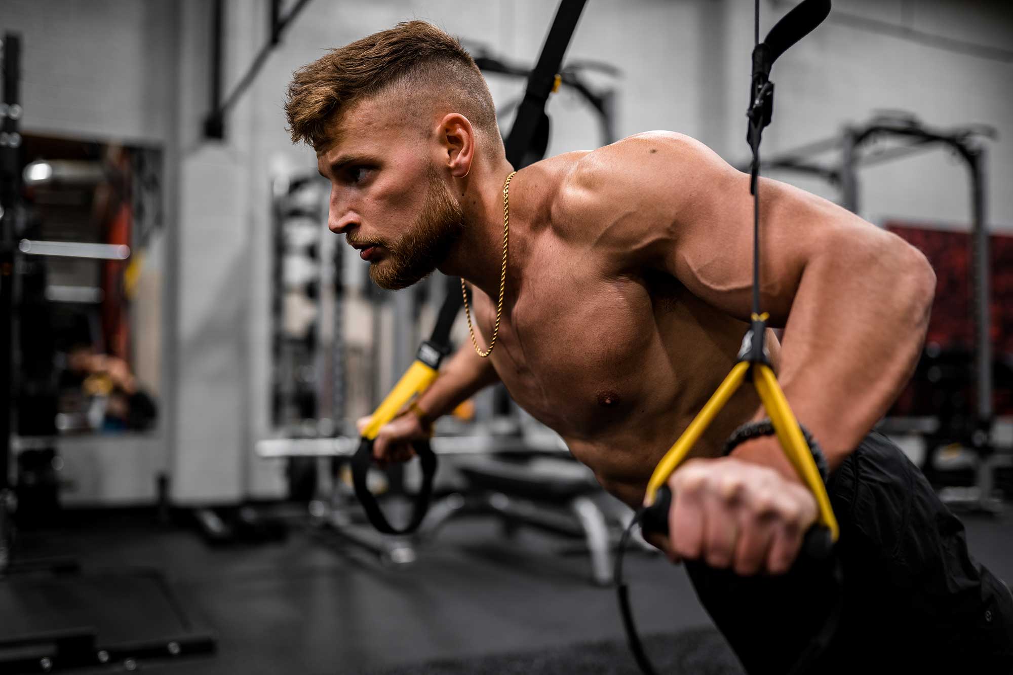 Man performing a suspension training exercise